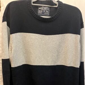 Nautica Jeans and Company . Colors are navy blue and gray .